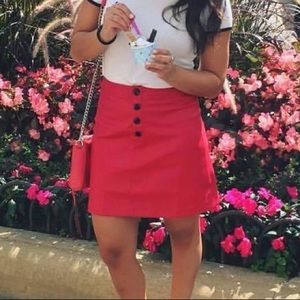 Mango red vegan leather mini w/ snap detail. Size US 4, machine wash, hang dry